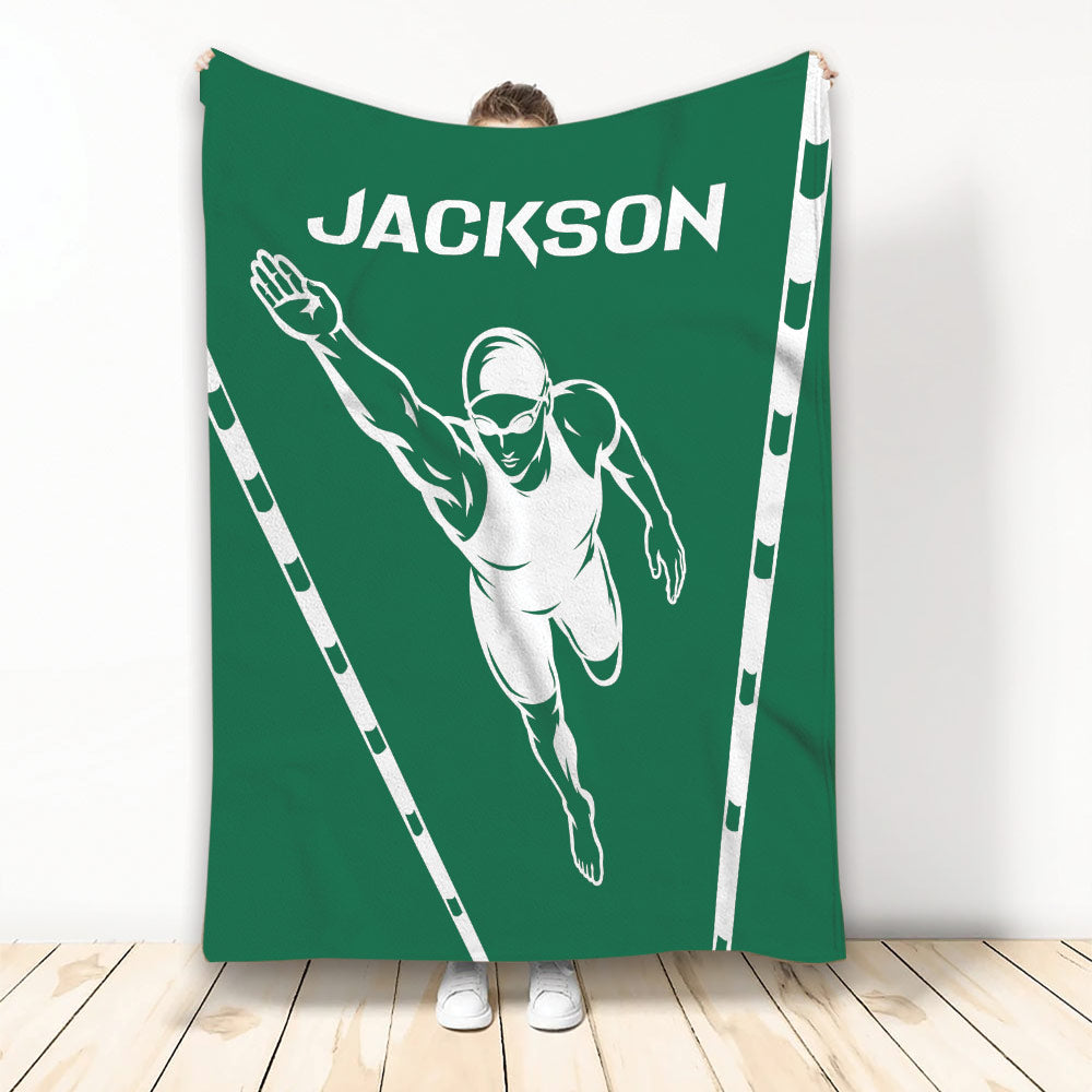 Green swimming throw blanket with a streamlined swimmer illustration and white lane border