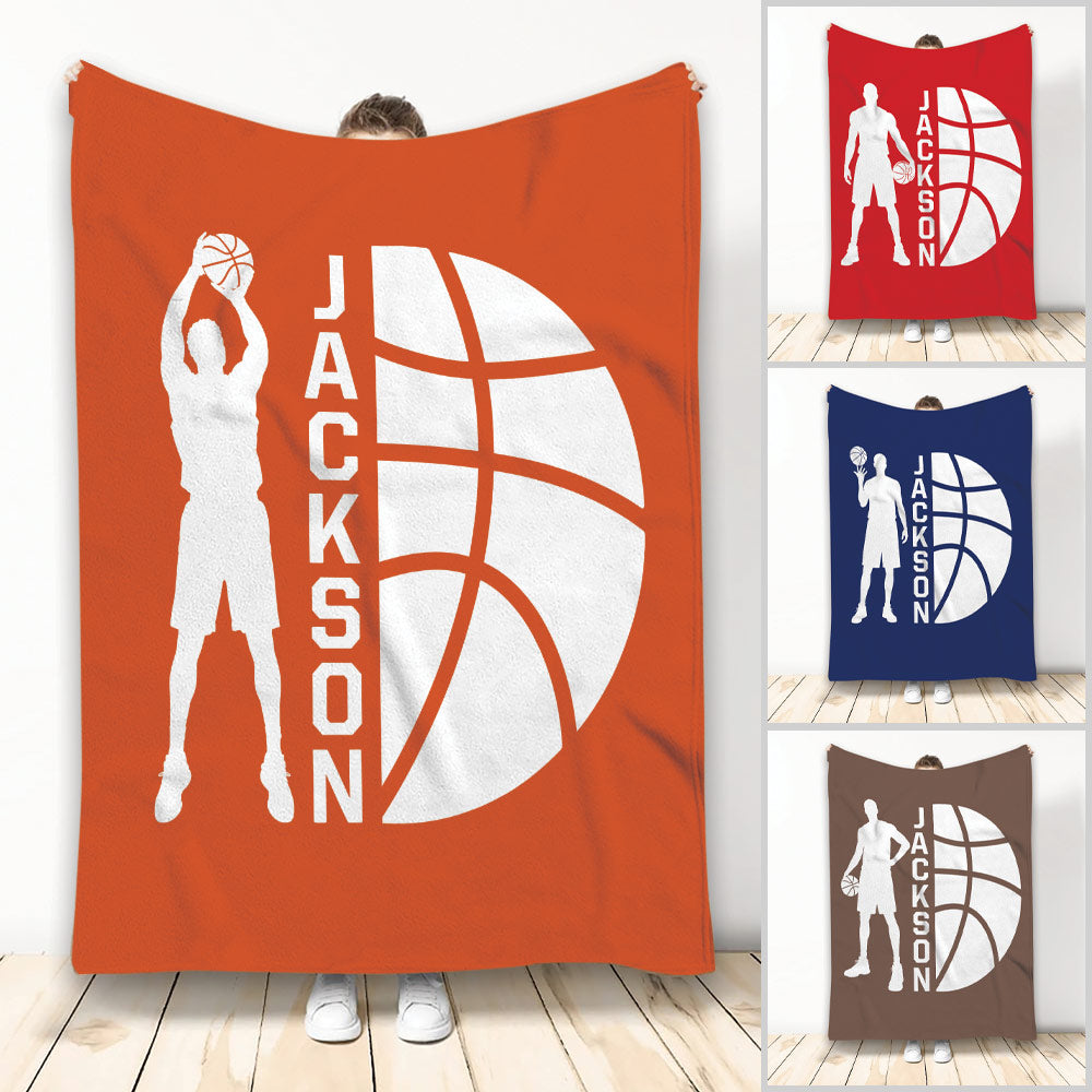 Basketball throw blanket featuring a white player silhouette and oversized basketball graphic in orange