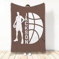 Brown basketball blanket displayed vertically with a player silhouette holding a basketball