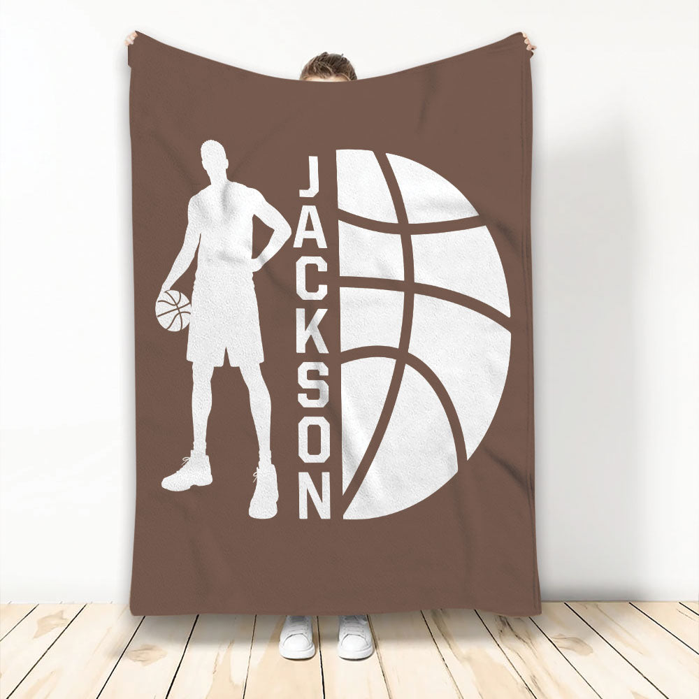 Brown basketball blanket displayed vertically with a player silhouette holding a basketball