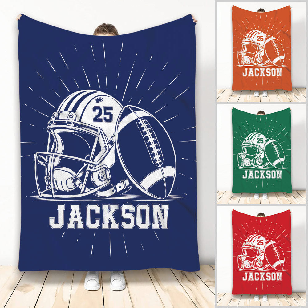 Football blanket featuring a helmet and football artwork in navy, orange, green, and red color options