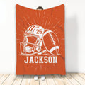 Orange football blanket displayed upright with helmet, football, and bold sports artwork
