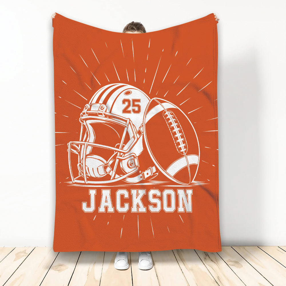Orange football blanket displayed upright with helmet, football, and bold sports artwork