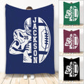 Navy football throw blanket featuring a helmeted player and bold oval football artwork