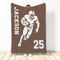 Brown football blanket featuring a helmeted ball carrier and large athletic jersey-style number graphic