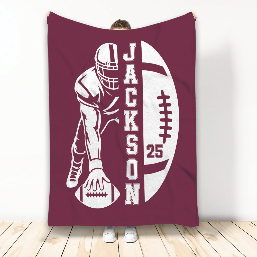 Maroon football blanket featuring a helmeted player silhouette and bold football design