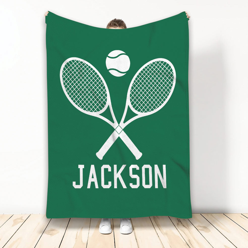 Green tennis blanket featuring crossed white rackets and a tennis ball design