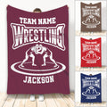 Wrestling throw blanket shown in multiple colors with wrestler artwork and bold team-style design