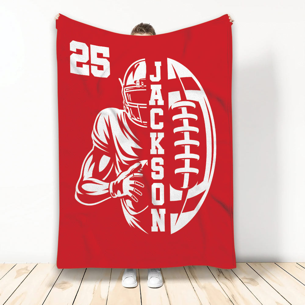 Red football blanket featuring a helmeted player holding a football