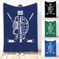 Blue hockey throw blanket with crossed sticks, skate, helmet, and bold monochrome sports artwork