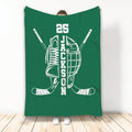 Green hockey throw blanket displaying a skate, helmet, crossed sticks, and white sports artwork
