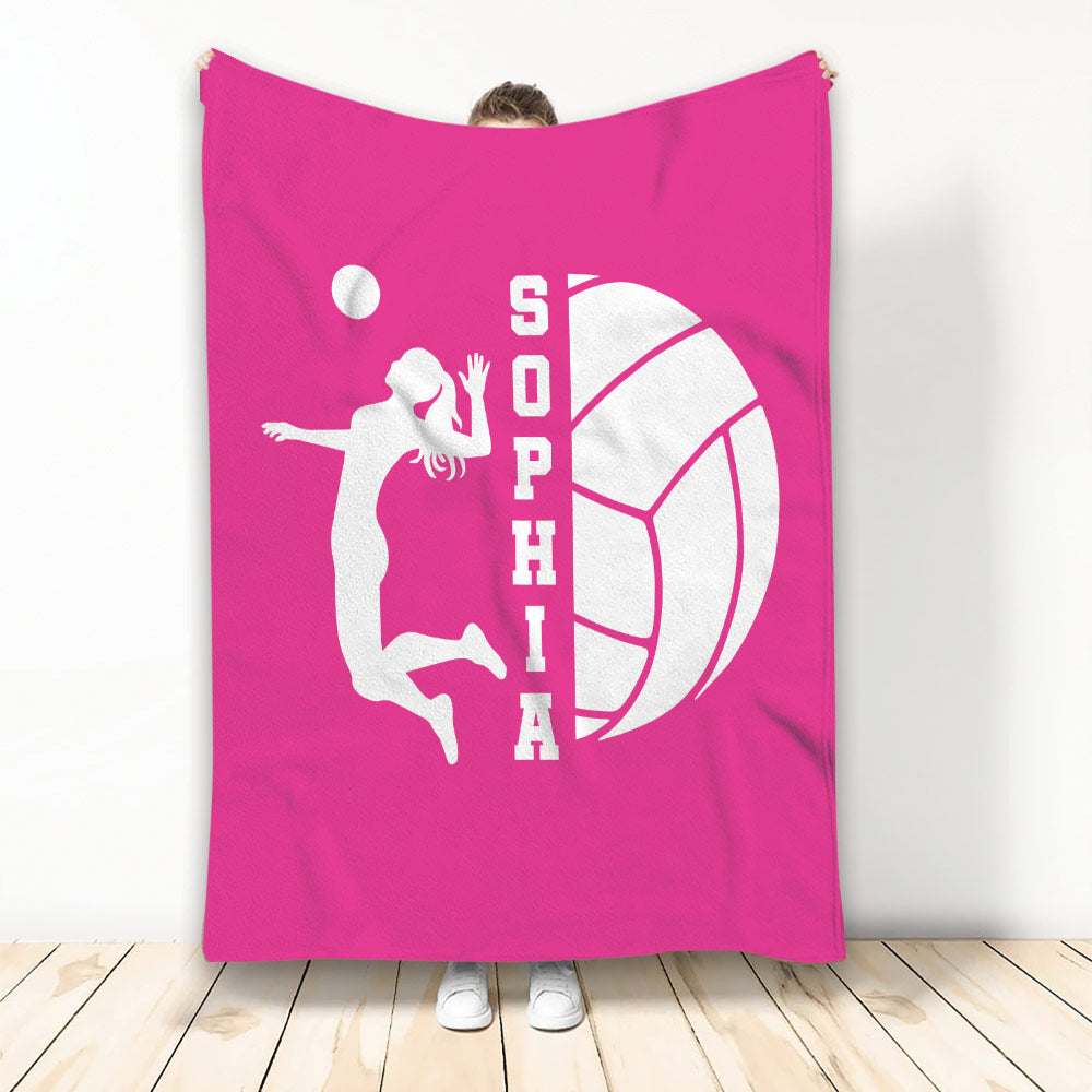 Bright pink volleyball throw blanket with a white jumping player silhouette and large volleyball graphic