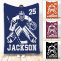 Hockey goalie throw blanket shown in navy with bold athletic artwork and multiple color examples