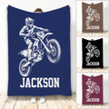 Custom motocross blanket featuring a helmeted dirt bike rider in bold white artwork on color choices