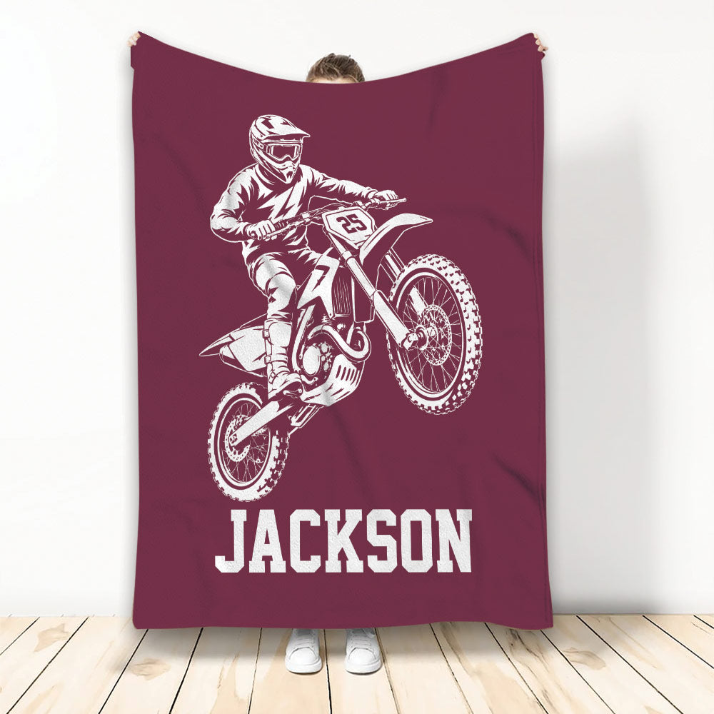 Maroon motocross blanket displaying a helmeted dirt bike rider and bold sports graphic