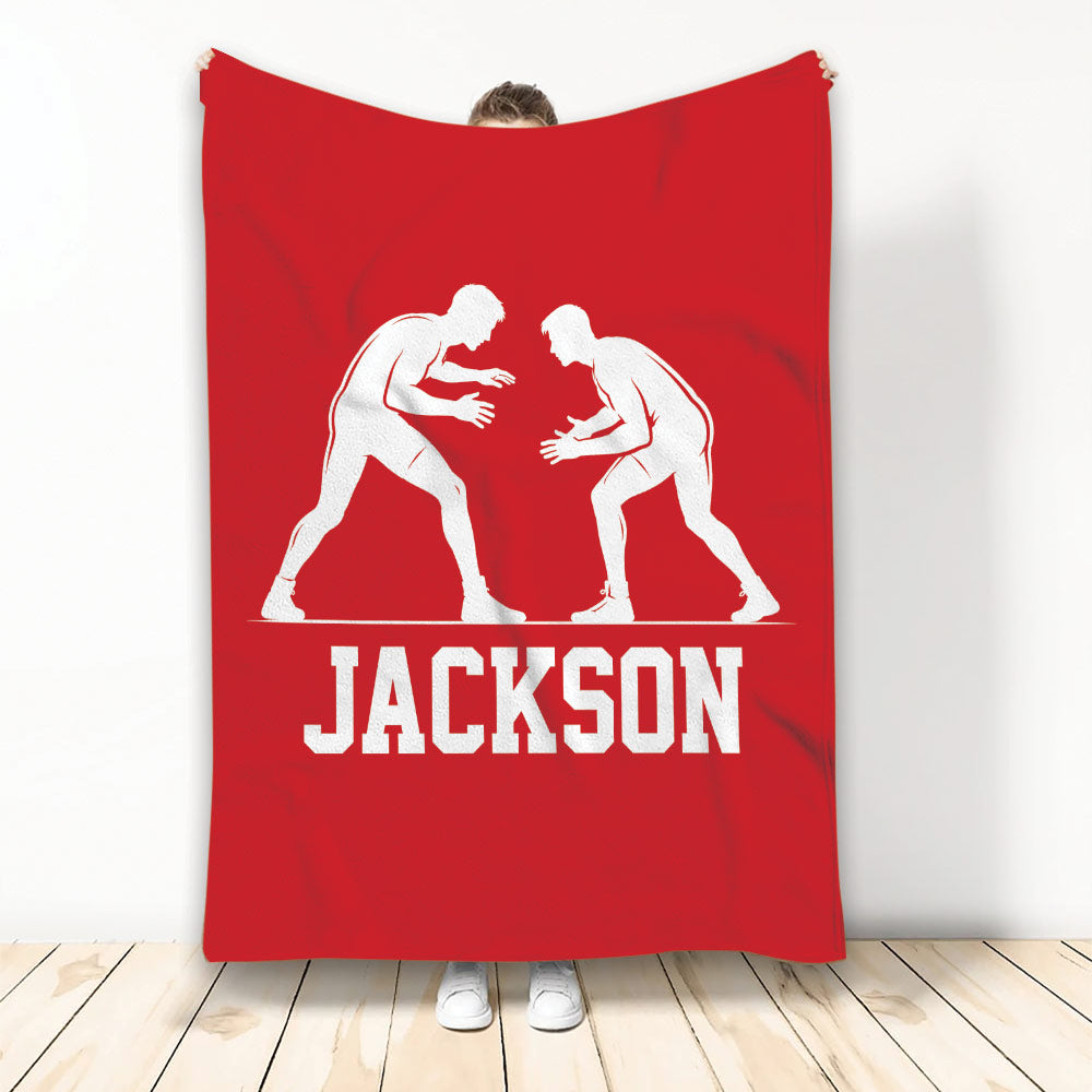 Red wrestling throw blanket featuring two white grappler silhouettes in a ready stance