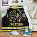 Firefighter throw blanket draped over a sofa with bold fire service emblem artwork