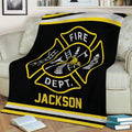 Black firefighter blanket shown on a sofa with yellow and silver fire department graphics
