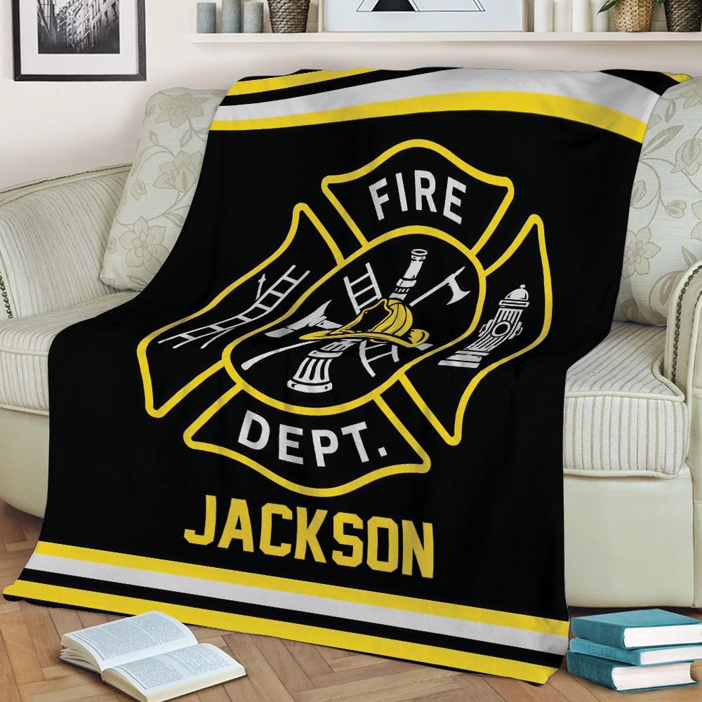 Black firefighter blanket shown on a sofa with yellow and silver fire department graphics
