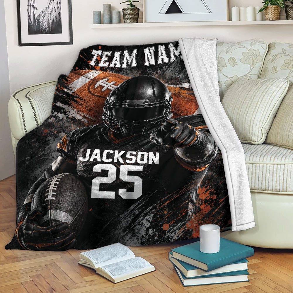 American football throw blanket displayed on a sofa with helmeted player artwork and bold sports graphics