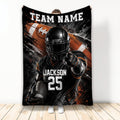 Football throw blanket with helmeted player, football artwork, and bold black, orange, and white sports design