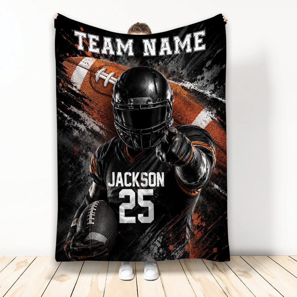 Football throw blanket with helmeted player, football artwork, and bold black, orange, and white sports design