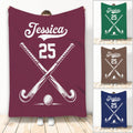 Custom hockey blanket design shown in multiple colors with crossed sticks and a hockey ball