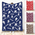 Custom hockey throw blanket with white ice hockey player silhouettes on a navy background