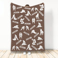Brown Jiu Jitsu blanket displaying repeating white grappling silhouettes and bold custom design elements