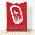 Red rock climbing blanket displaying a climber silhouette, mountain scene, rope, and large carabiner graphic