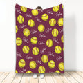 Maroon softball blanket featuring a repeating yellow softball pattern