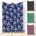 Custom motocross blanket featuring repeated dirt bike rider artwork in multiple color options