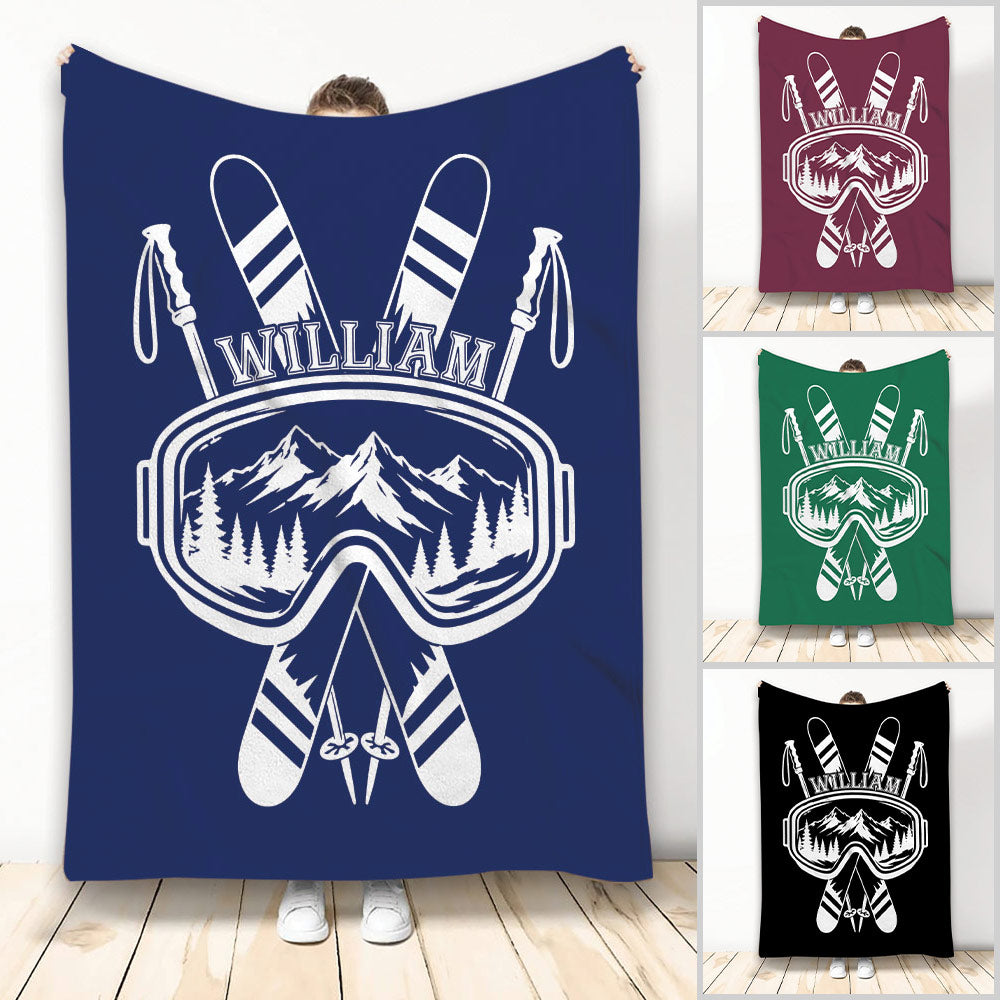 Custom skiing blanket with crossed skis, ski goggles, poles, and mountain artwork in multiple colors