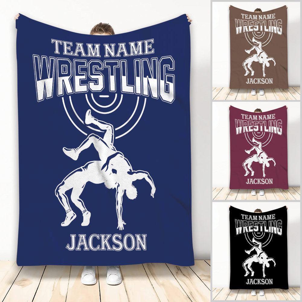 Wrestling throw blanket featuring a dramatic grappling silhouette, bold varsity lettering, and multiple color options
