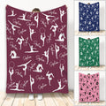 Gymnastics throw blanket with white gymnast silhouettes on a maroon background