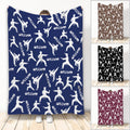 Taekwondo blanket with white martial artist silhouettes on a blue patterned design