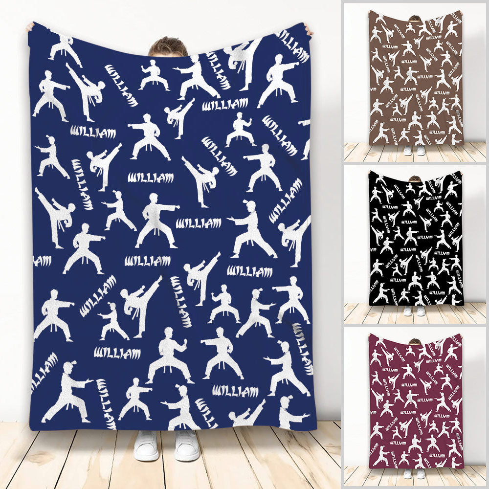 Taekwondo blanket with white martial artist silhouettes on a blue patterned design