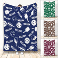 Navy pickleball throw blanket with paddle and perforated ball artwork in a repeating sports design
