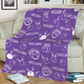 Purple bowling throw blanket styled on a sofa with bowling ball and pin illustrations