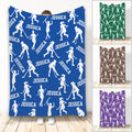 Blue hockey blanket featuring repeating white female hockey player silhouettes and bold sports artwork