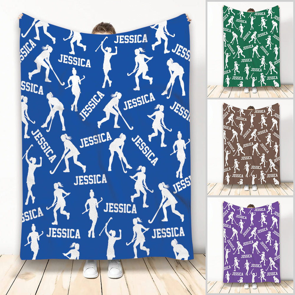 Blue hockey blanket featuring repeating white female hockey player silhouettes and bold sports artwork