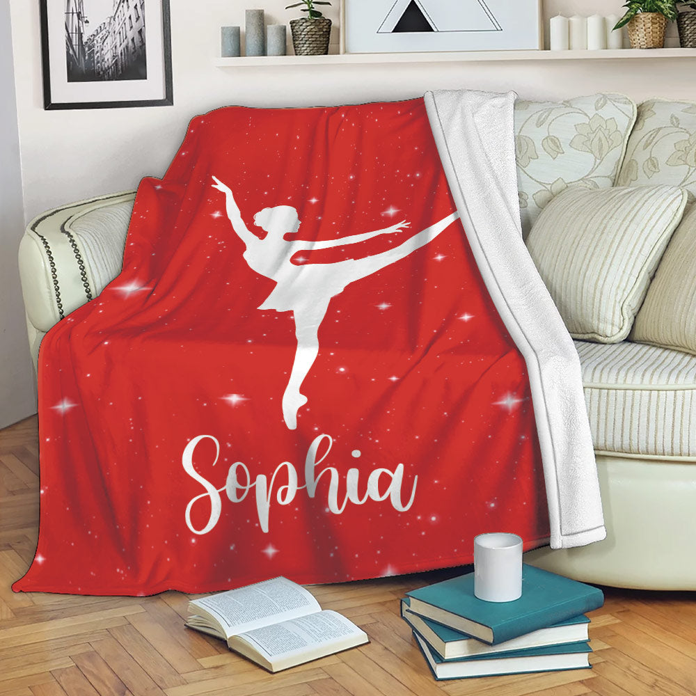 Red ballet throw blanket draped over a sofa with a white dancer silhouette and starry background
