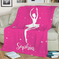 Pink ballet throw blanket on a sofa featuring a seated ballerina silhouette and starry artwork