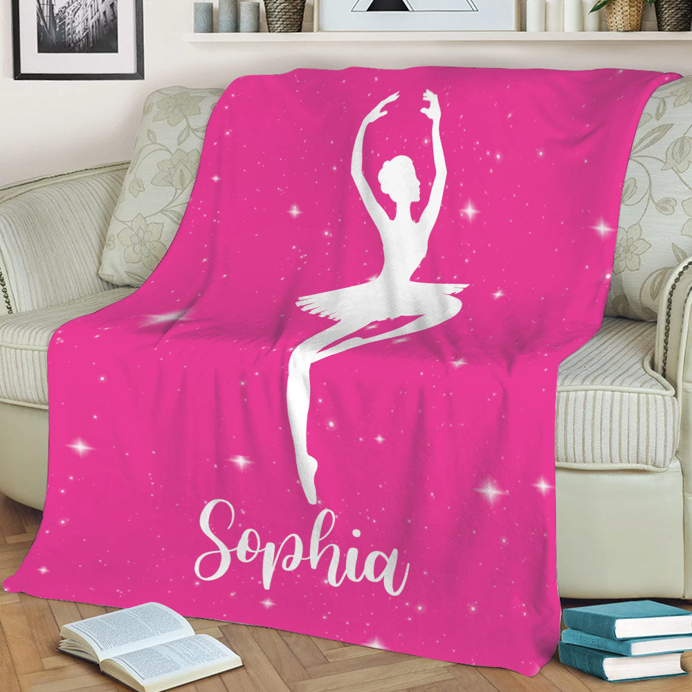 Pink ballet throw blanket on a sofa featuring a seated ballerina silhouette and starry artwork