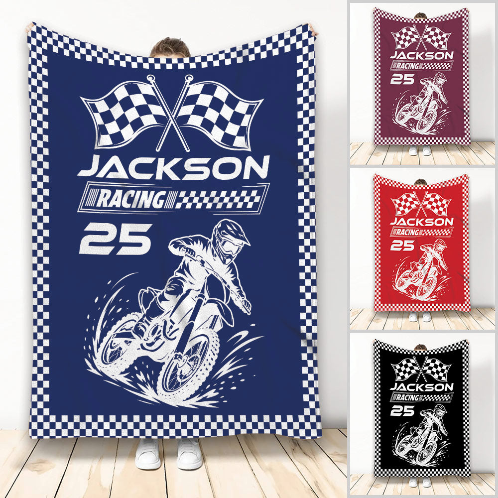 Motocross throw blanket with dirt bike rider, racing flags, and checkered border in blue