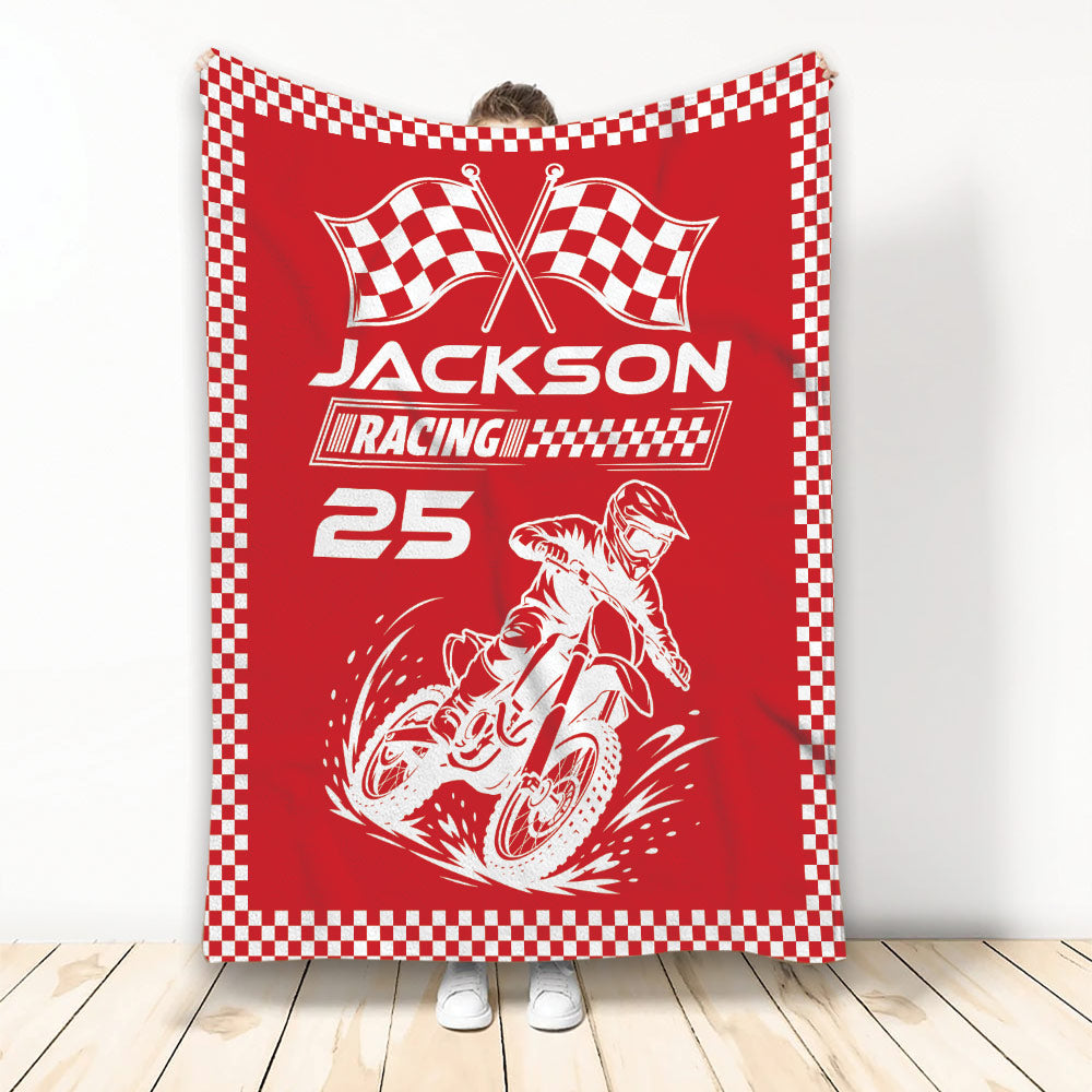 Red motocross throw blanket featuring a dirt bike rider and checkered racing border