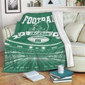 Green football blanket displayed on a sofa with helmet, stadium, field, and football artwork