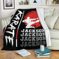 Custom karate throw blanket displayed on a sofa with black, white and red martial arts artwork