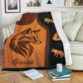 Fox throw blanket displayed on a sofa with rustic orange and black woodland artwork