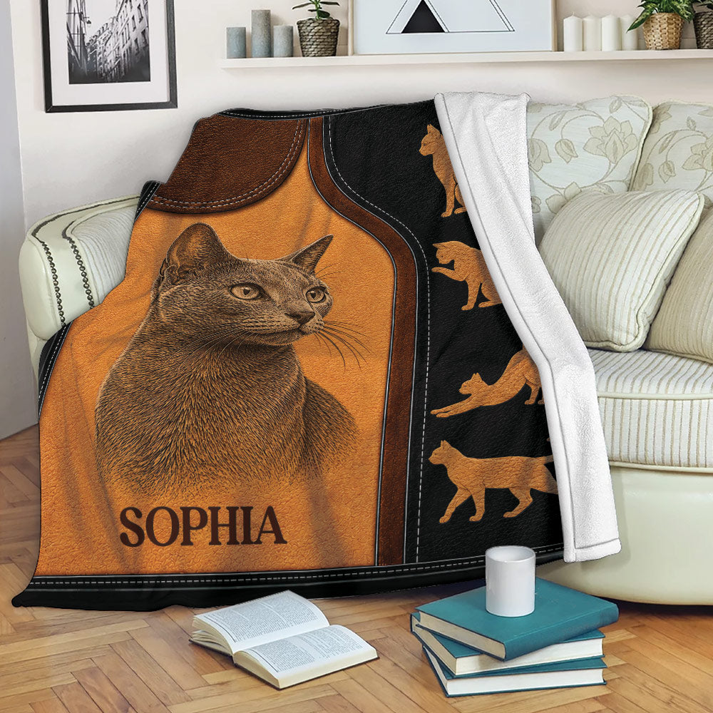 Russian Blue cat blanket draped over a living room sofa with feline silhouette details